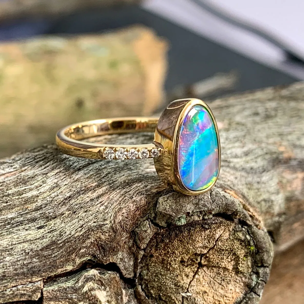 14kt Yellow Gold Opal doublet red green flash and diamond band ring