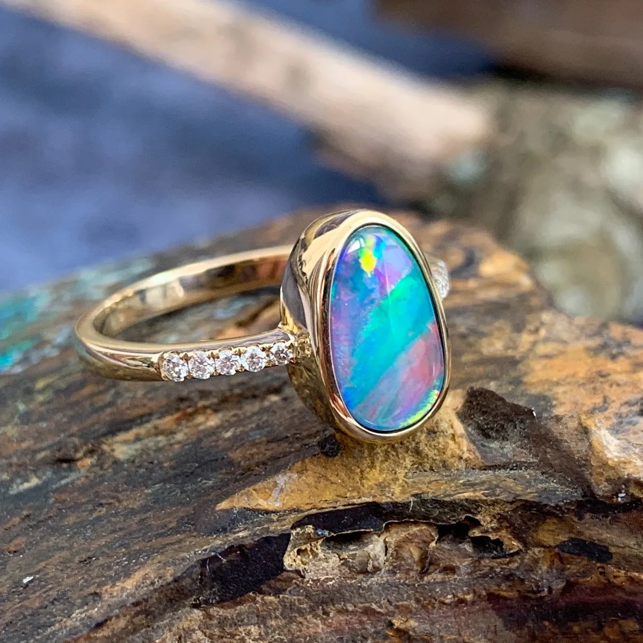 14kt Yellow Gold Opal doublet red green flash and diamond band ring