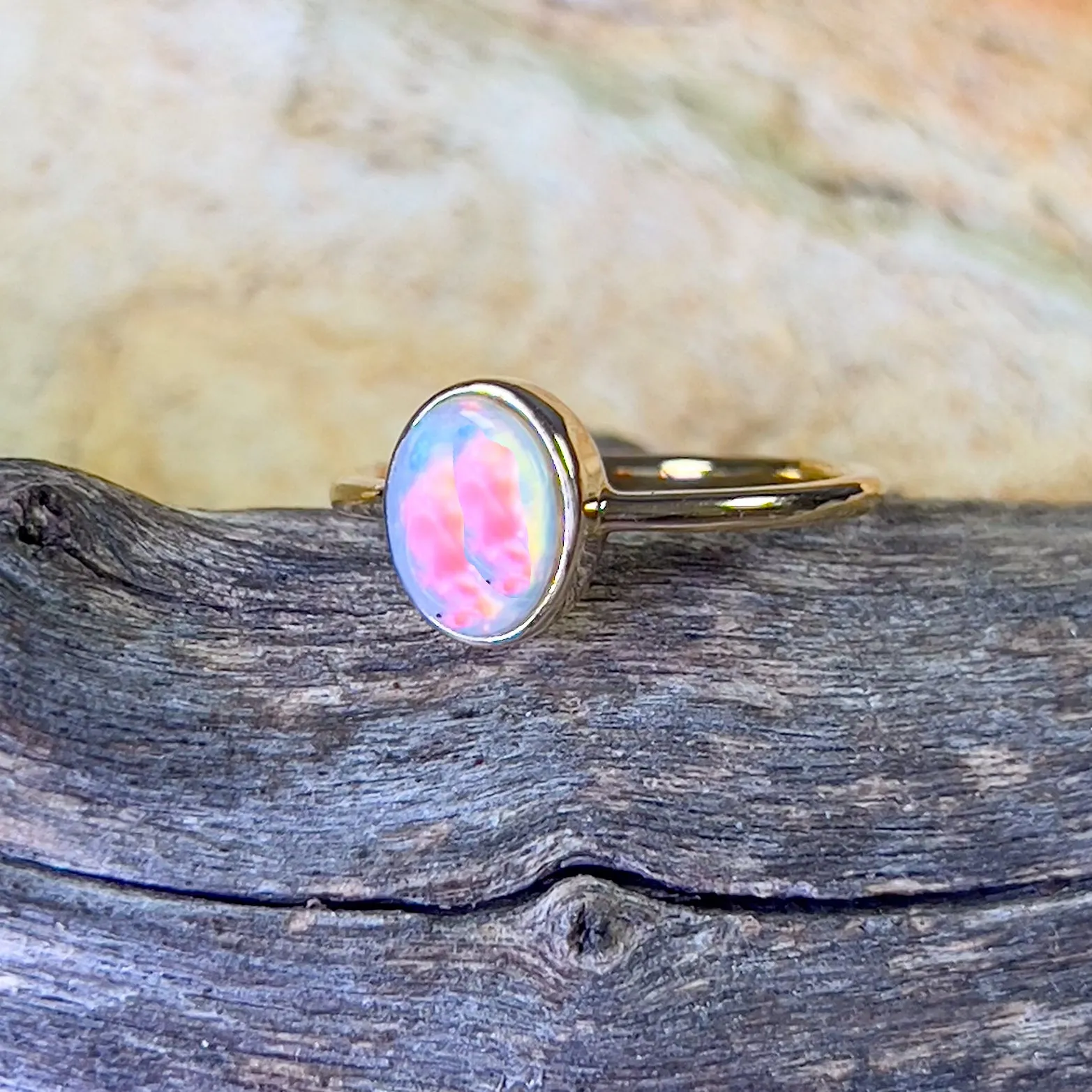 14kt Yellow Gold solitaire Oval Opal bezel set ring