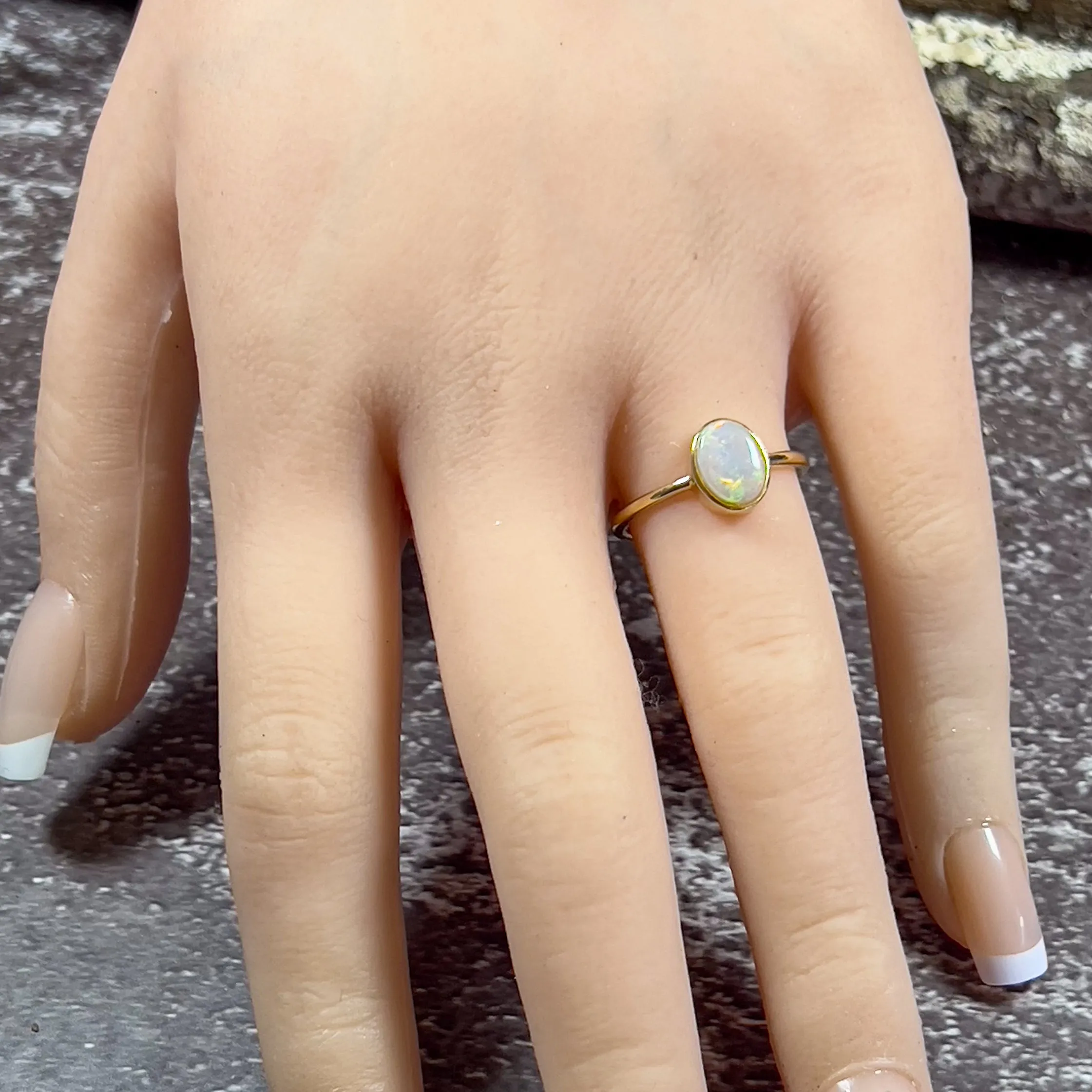 14kt Yellow Gold solitaire Oval Opal bezel set ring