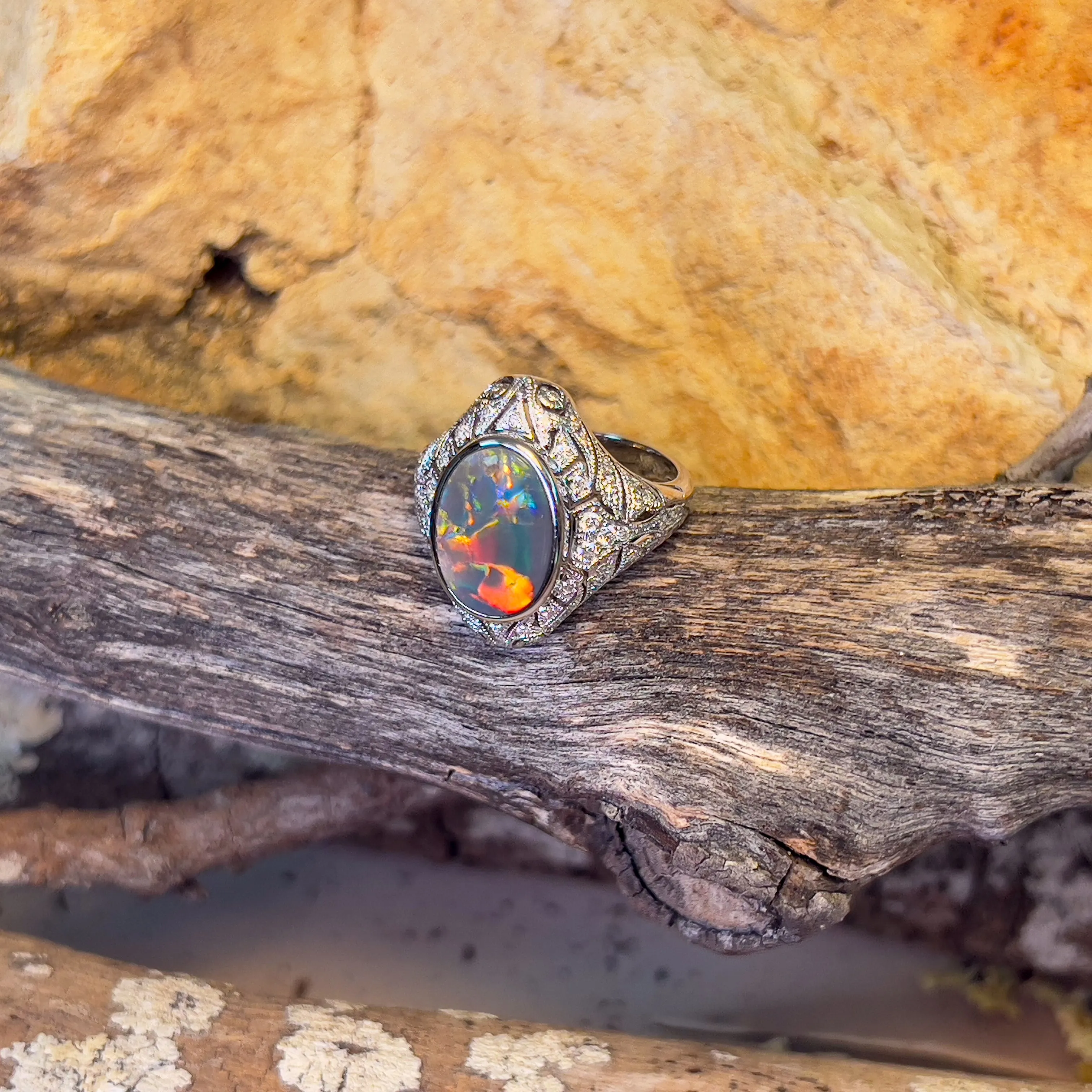 18kt White Gold Black Opal and diamond filligree style ring