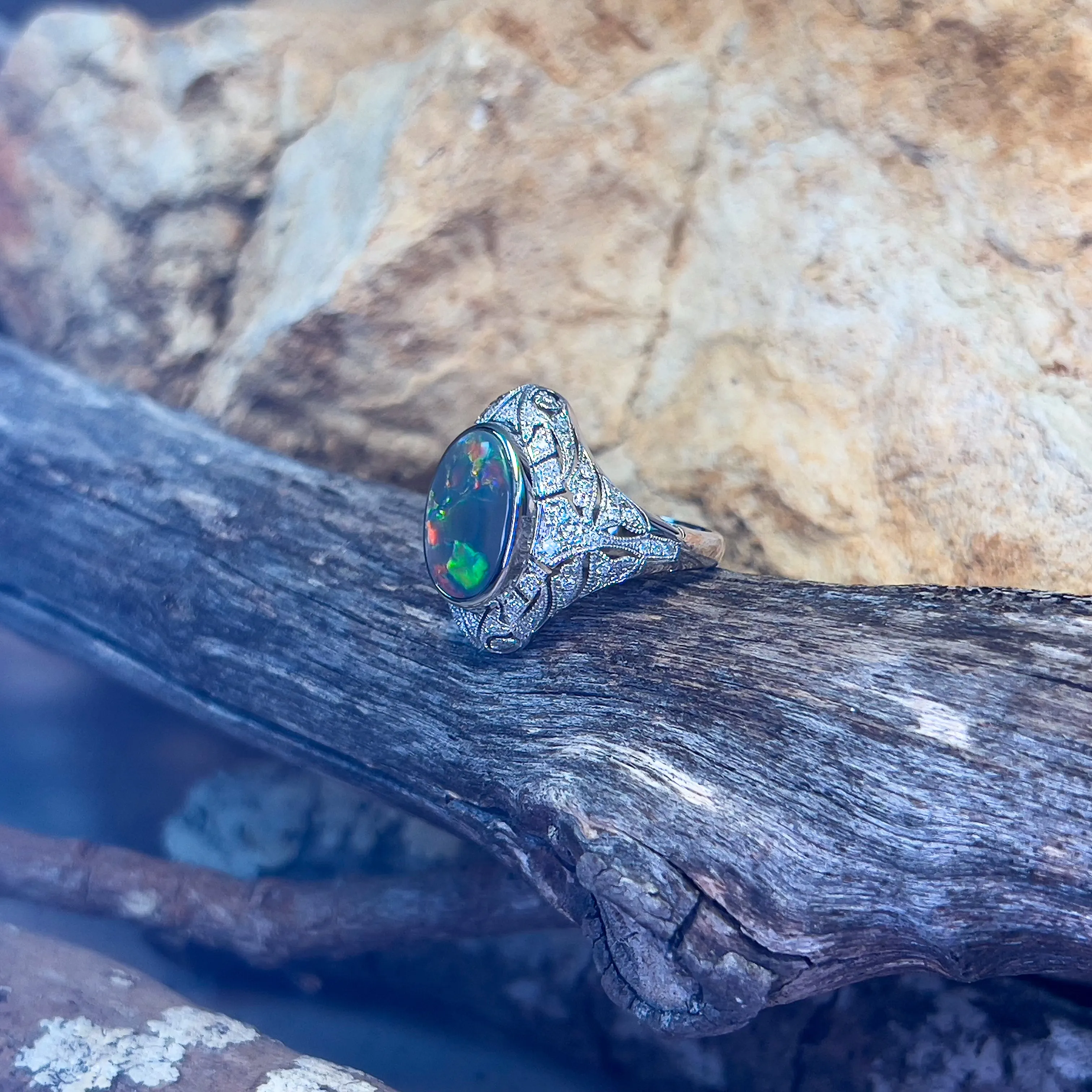 18kt White Gold Black Opal and diamond filligree style ring