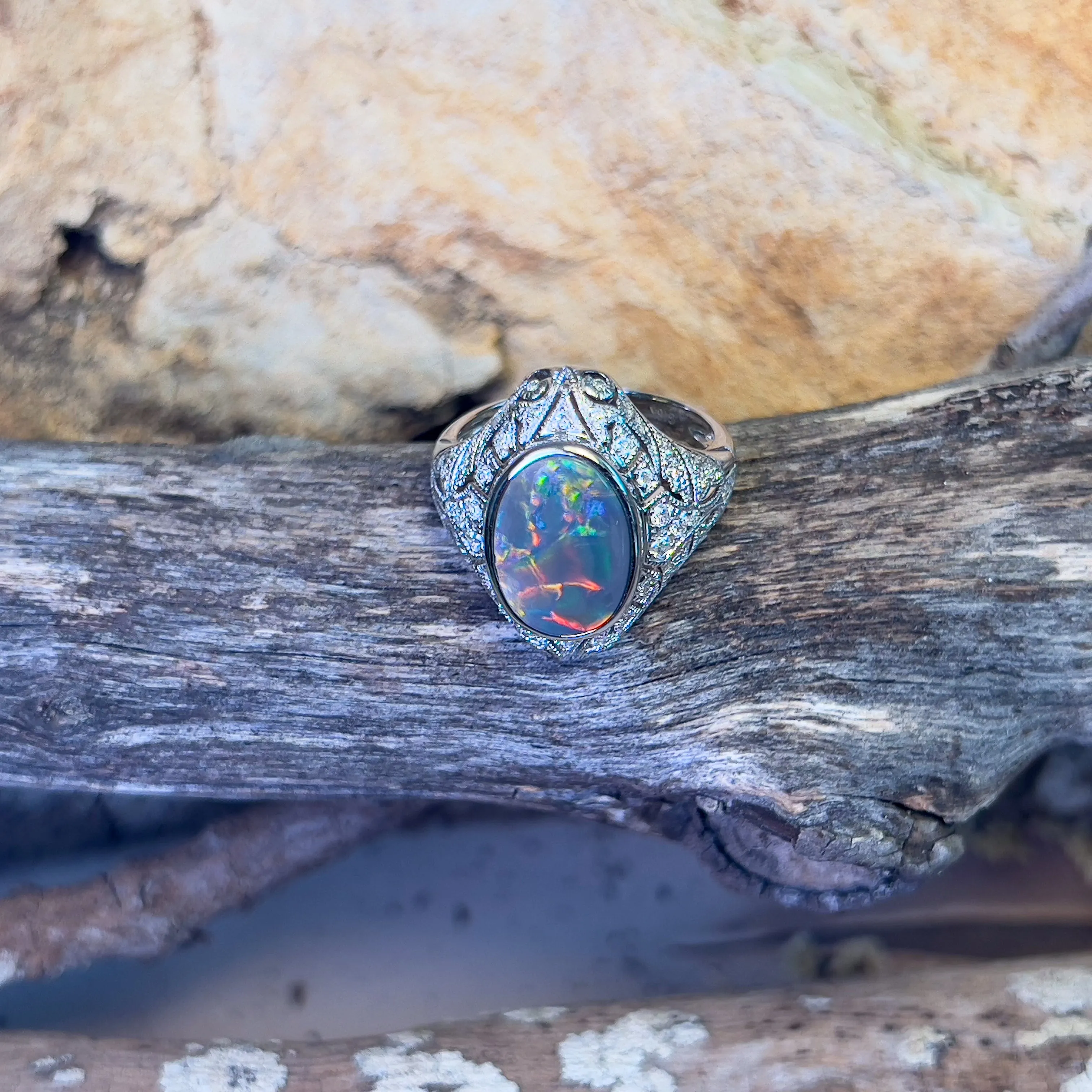 18kt White Gold Black Opal and diamond filligree style ring