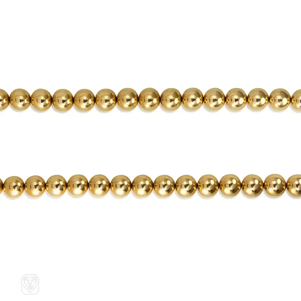 Gold bead necklace of adjustable length