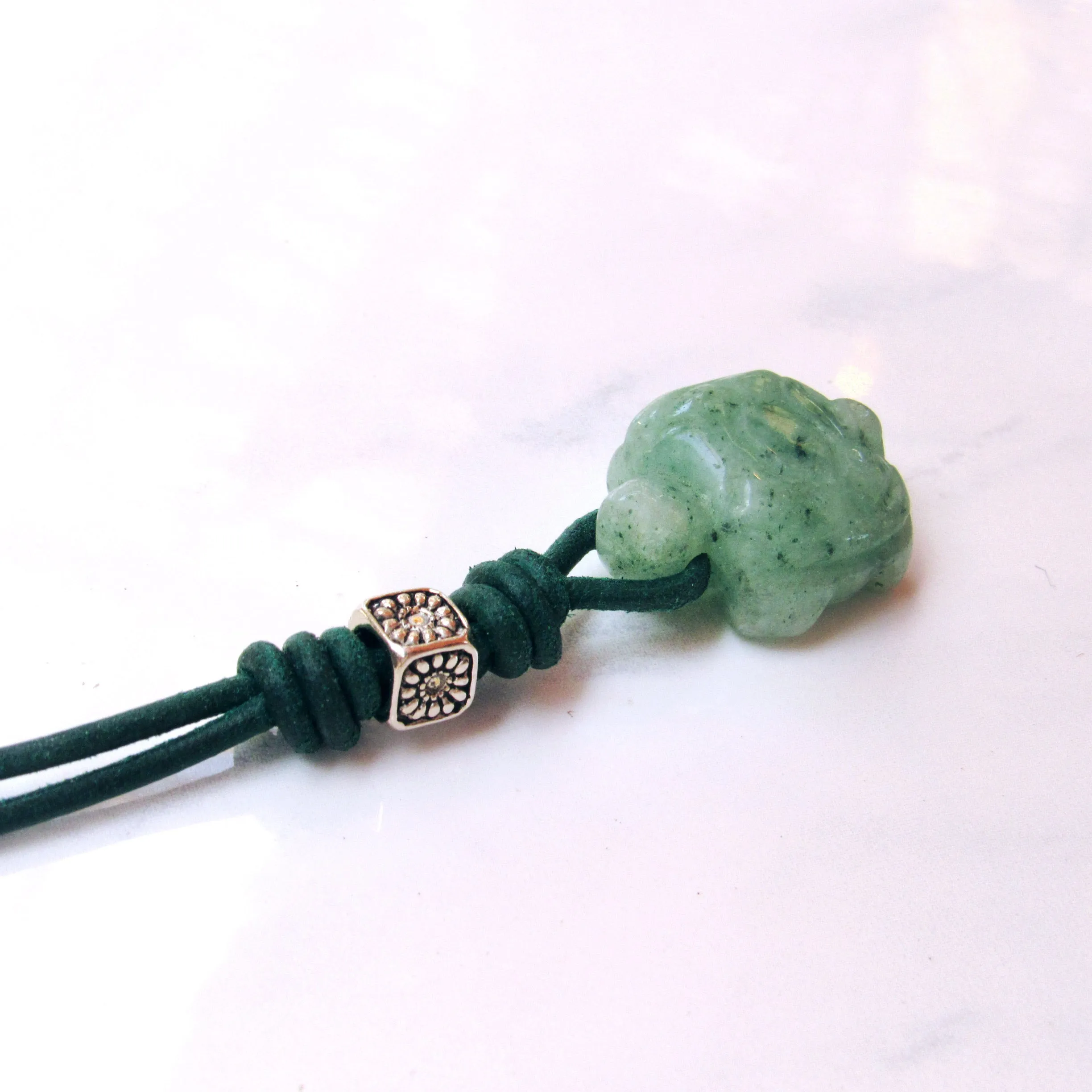 Jade Turtle gemstone on green leather with Sterling Silver