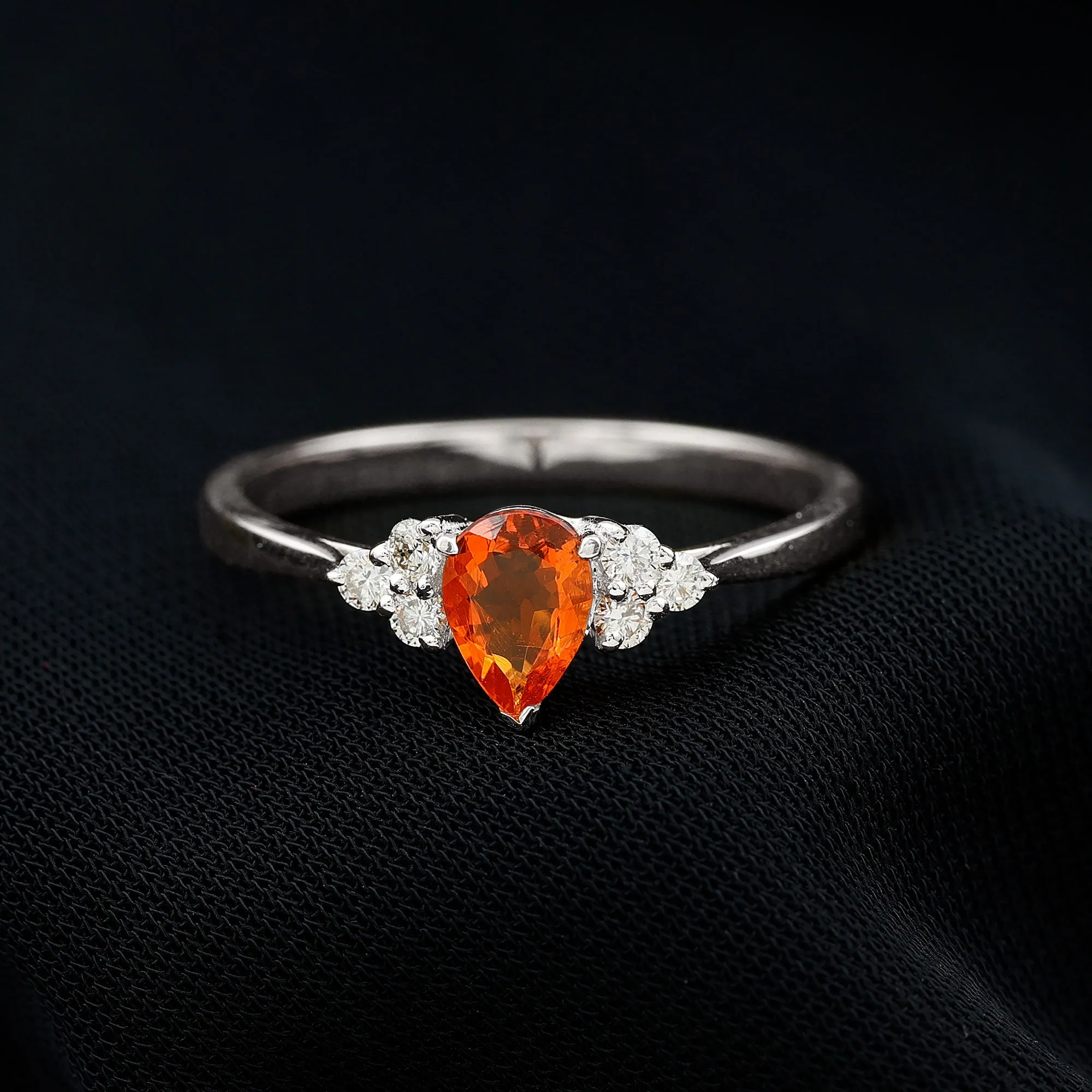 Pear Shaped Fire Opal Solitaire Ring with Diamond Trio