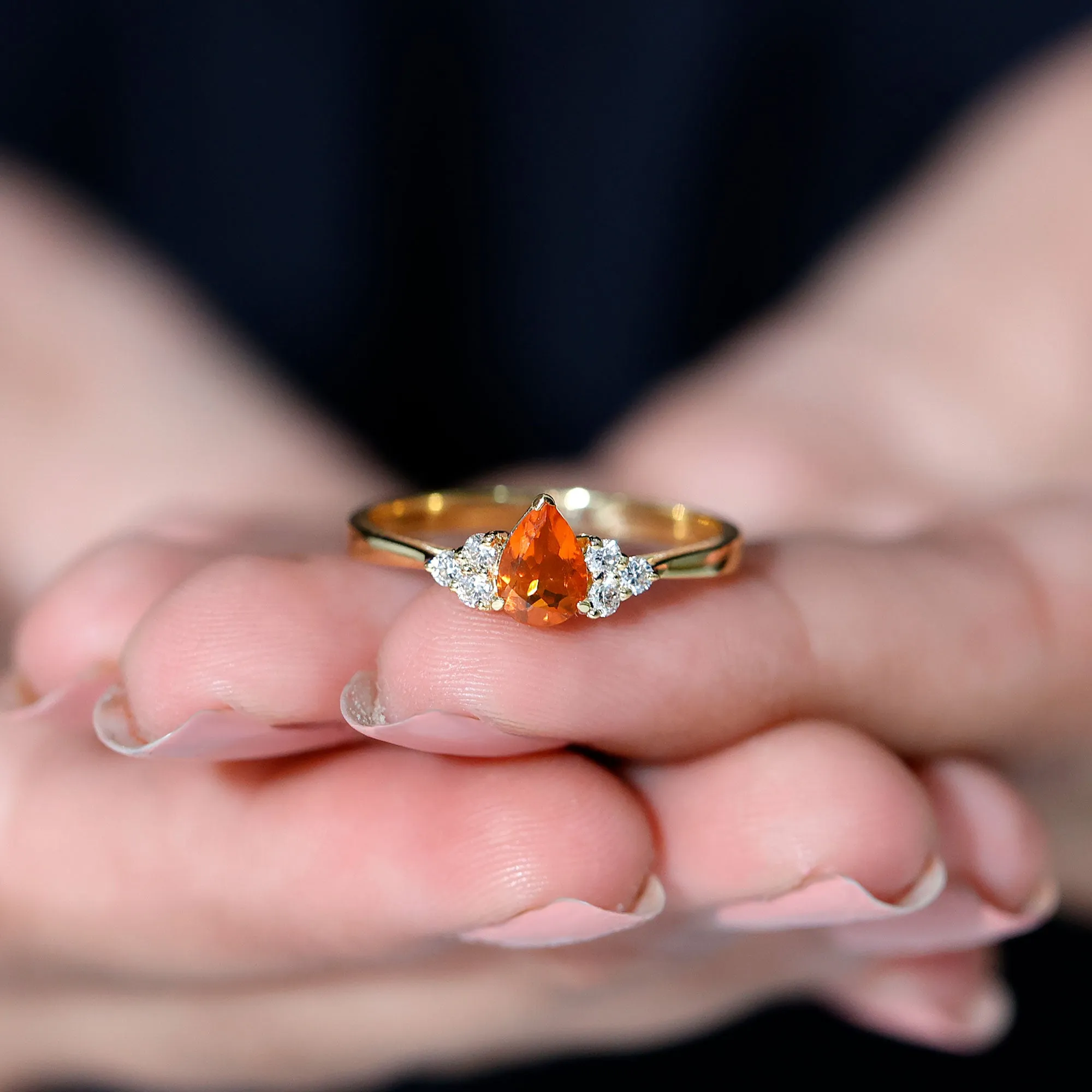 Pear Shaped Fire Opal Solitaire Ring with Diamond Trio