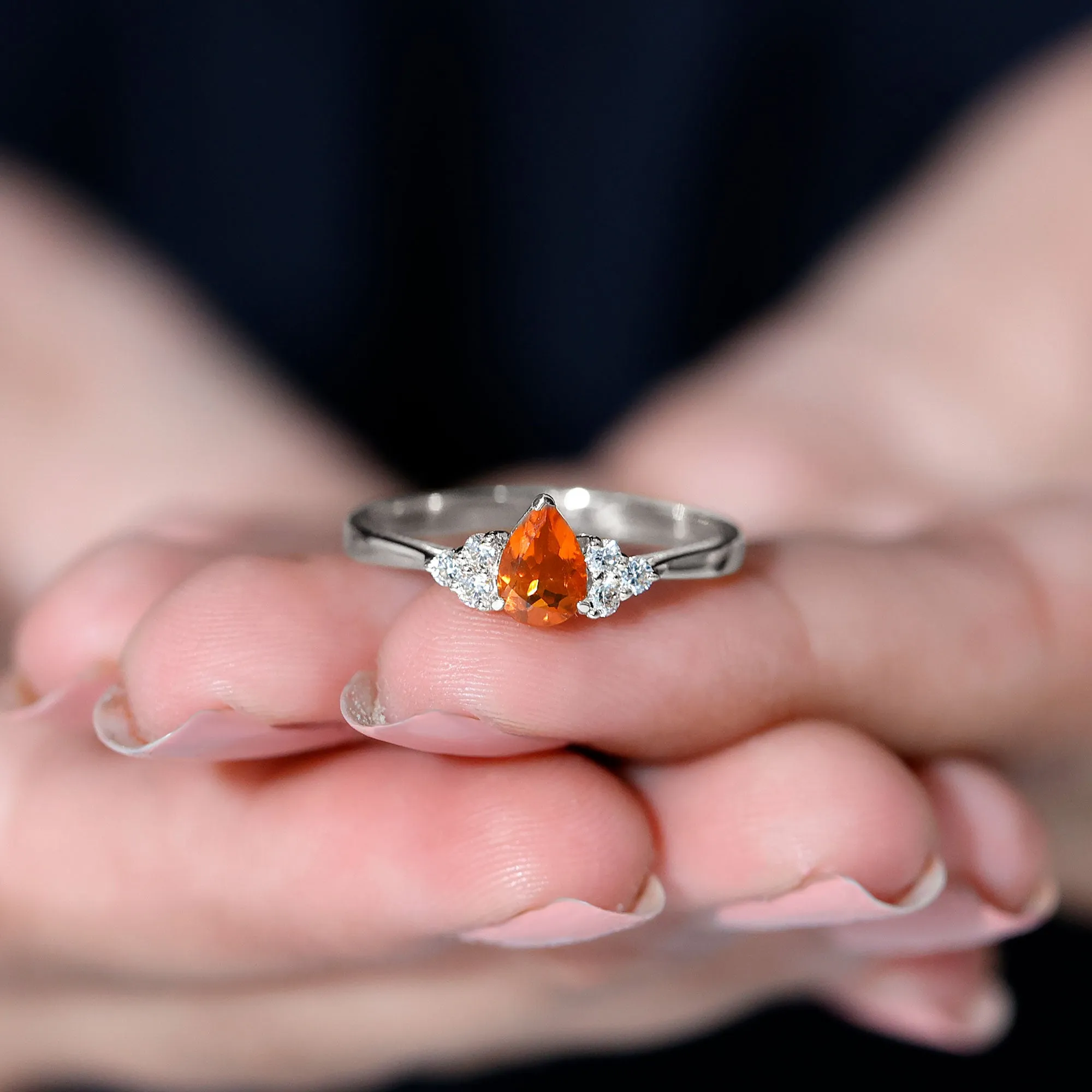 Pear Shaped Fire Opal Solitaire Ring with Diamond Trio