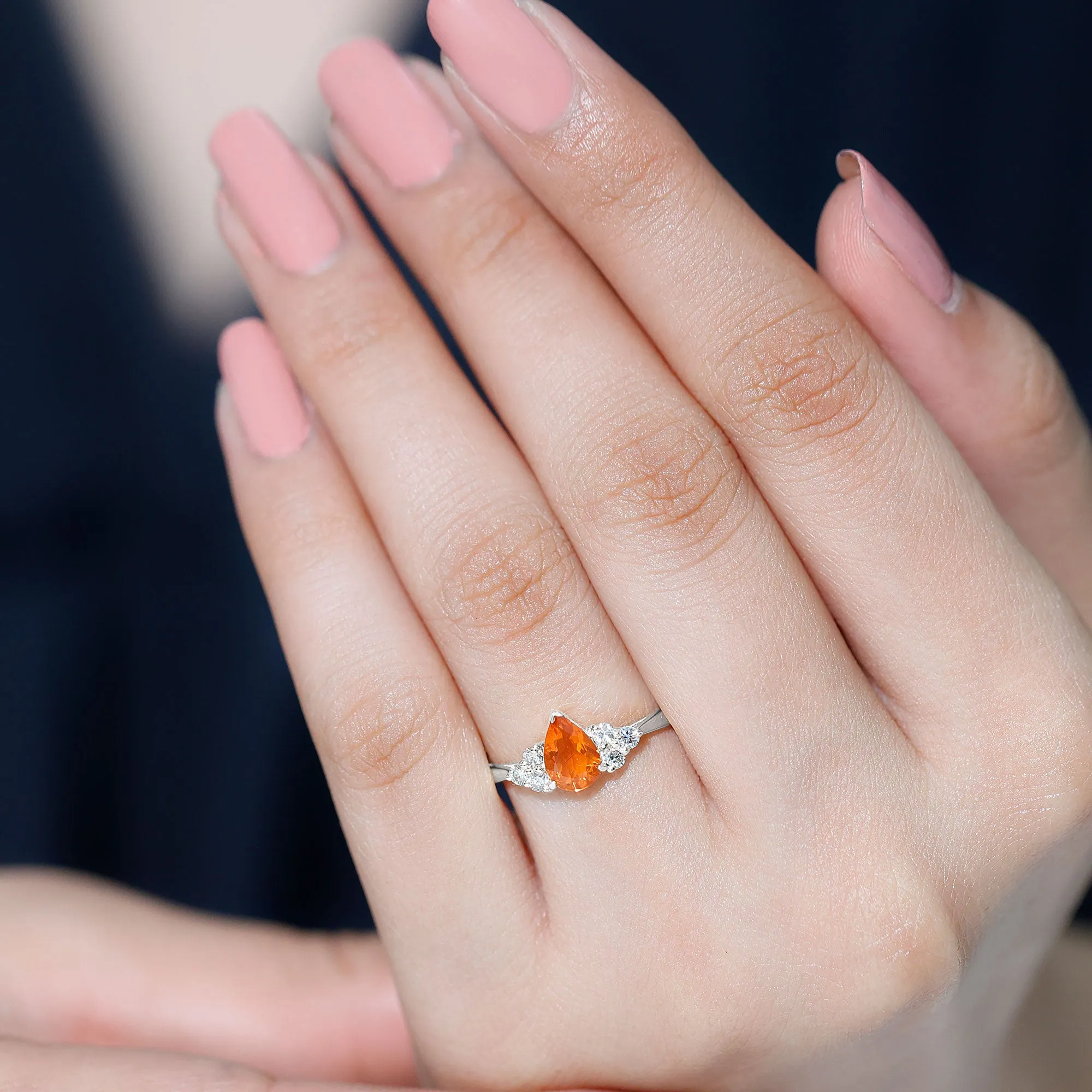 Pear Shaped Fire Opal Solitaire Ring with Diamond Trio