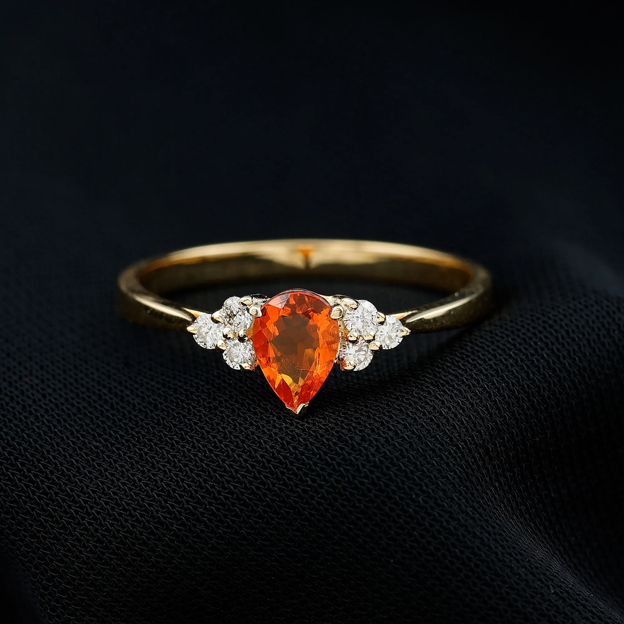 Pear Shaped Fire Opal Solitaire Ring with Diamond Trio